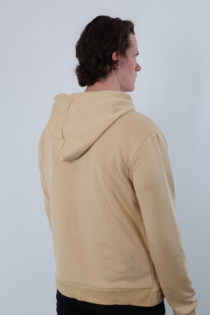 A person stands facing away, wearing a Nectar Nomad unisex hoodie against a plain backdrop.