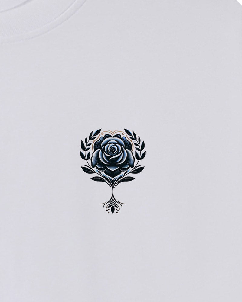 Aegean Rose T-Shirt: A white shirt adorned with a detailed black rose and surrounding leaves design.